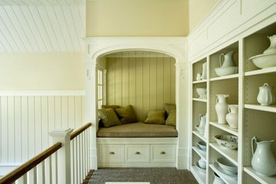 Example of a mid-sized cottage chic carpeted family room library design in Boston with multicolored walls and no tv