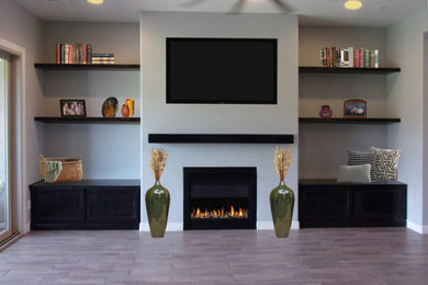 Mid-sized transitional open concept ceramic tile and gray floor family room photo in Phoenix with white walls, a metal fireplace and a wall-mounted tv