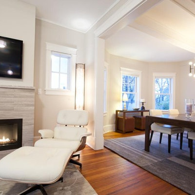 Inspiration for a mid-sized transitional open concept medium tone wood floor and brown floor family room remodel in New York with beige walls, a ribbon fireplace, a wall-mounted tv and a stone fireplace