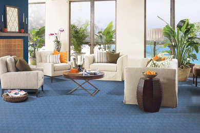 Inspiration for a carpeted family room remodel in Little Rock with white walls