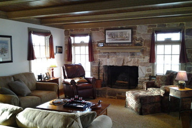 Example of a mountain style family room design in Other