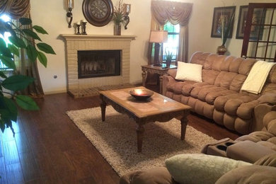 Family room - traditional dark wood floor family room idea in Houston with beige walls