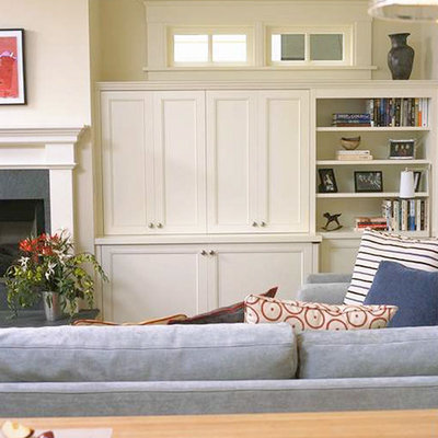 Inspiration for a mid-sized timeless open concept light wood floor family room remodel in San Francisco with white walls, a standard fireplace, a stone fireplace and a media wall