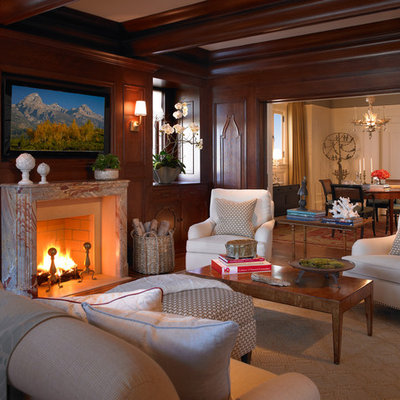 Elegant family room photo in San Francisco with brown walls, a standard fireplace and a wall-mounted tv