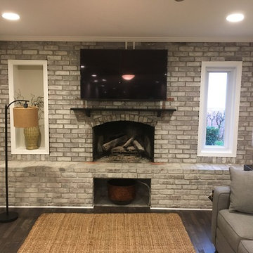 Painted brick fireplace with white trim