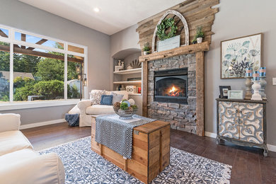 Example of a large arts and crafts open concept dark wood floor family room design in Other with gray walls and a standard fireplace