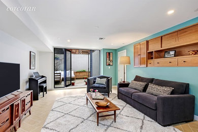 На фото: гостиная комната среднего размера в современном стиле с зелеными стенами, полом из керамогранита, отдельно стоящим телевизором и бежевым полом