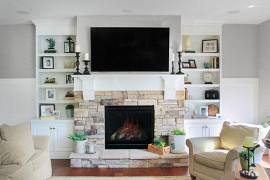Example of a transitional family room design in St Louis