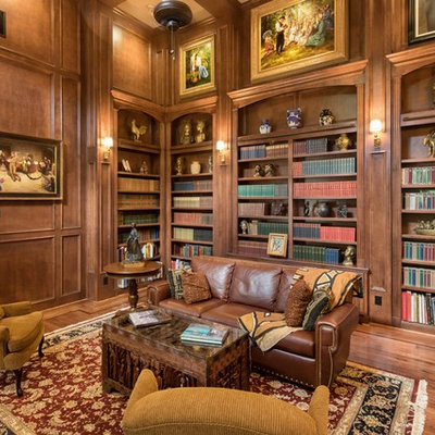 Inspiration for a victorian enclosed dark wood floor and brown floor family room library remodel in Houston with brown walls and no tv