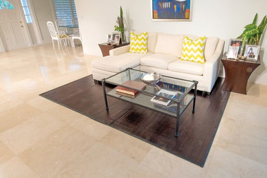 Family room - mid-sized contemporary marble floor and beige floor family room idea in Miami with gray walls and a tv stand