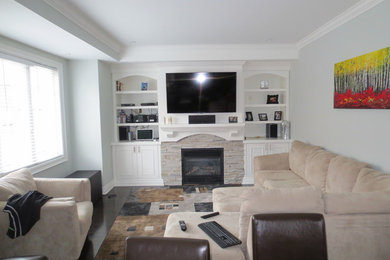 Example of a classic family room design in Toronto
