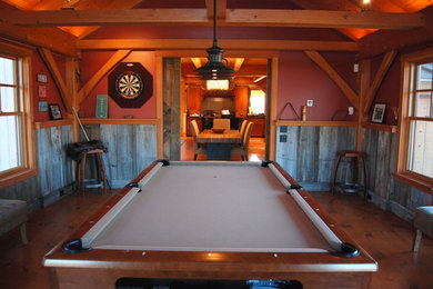 Medium sized traditional enclosed games room in New York with a game room, red walls, medium hardwood flooring and no fireplace.