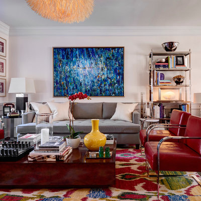 Inspiration for a transitional family room remodel in Charlotte with pink walls