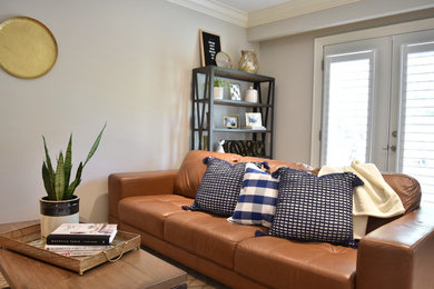 Example of a small transitional open concept family room design in Toronto
