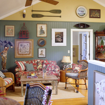Beach style medium tone wood floor family room photo in Los Angeles with gray walls
