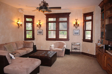 Example of a tuscan family room design in Los Angeles