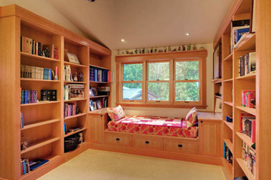 Inspiration for a rustic enclosed carpeted family room library remodel in Seattle with beige walls