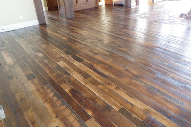 This is an example of a farmhouse games room in Salt Lake City with dark hardwood flooring.