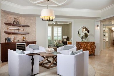 Example of a mid-sized beach style open concept travertine floor, beige floor and shiplap ceiling family room design in Miami with a bar and beige walls