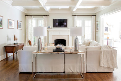 Large 1950s open concept medium tone wood floor family room photo in Charlotte with gray walls, a standard fireplace, a tile fireplace and a wall-mounted tv