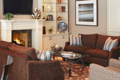 Inspiration for a transitional dark wood floor family room remodel in Toronto with a standard fireplace, a wood fireplace surround and a wall-mounted tv