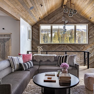 Inspiration for a rustic open concept brown floor and medium tone wood floor family room remodel in Los Angeles with white walls and no fireplace
