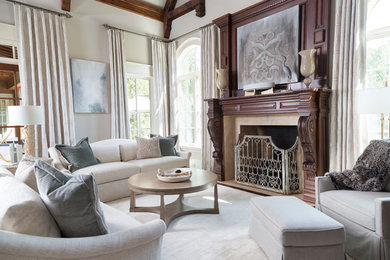 Inspiration for a large timeless enclosed dark wood floor and brown floor family room remodel in Atlanta with white walls, a standard fireplace and a stone fireplace