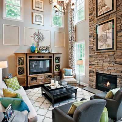 Inspiration for a transitional open concept family room remodel in Chicago with beige walls, a standard fireplace, a stone fireplace and a tv stand