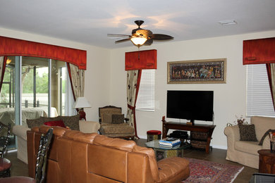 Mid-sized elegant open concept brown floor family room photo in Tampa with beige walls, no fireplace and a tv stand