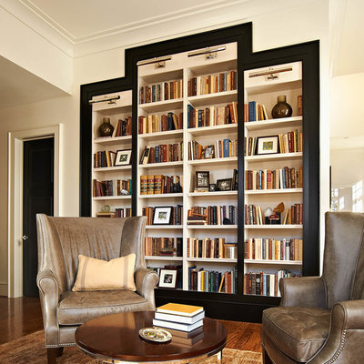 Inspiration for a transitional family room remodel in Raleigh with white walls
