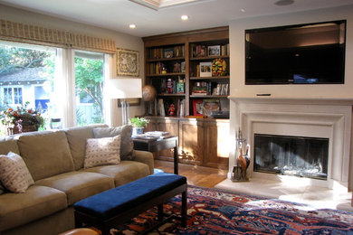 Large transitional open concept medium tone wood floor family room photo in San Francisco with white walls, a standard fireplace, a wood fireplace surround and a media wall