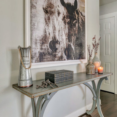 Large mountain style open concept medium tone wood floor family room photo in Los Angeles with gray walls, no fireplace and a wall-mounted tv