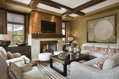 Inspiration for a large rustic open concept medium tone wood floor family room remodel in Denver with beige walls, a standard fireplace, a metal fireplace and no tv