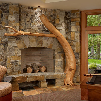 Inspiration for a rustic game room remodel in Seattle with a corner fireplace and a stone fireplace