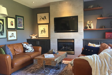 Mid-sized trendy open concept medium tone wood floor family room photo in Calgary with gray walls, a standard fireplace, a tile fireplace and a media wall