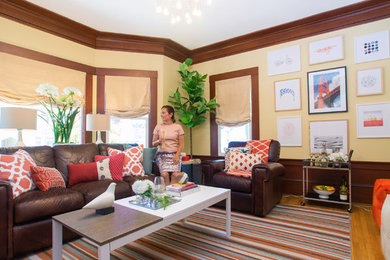 Example of a mid-sized transitional enclosed family room design in San Francisco with beige walls, a standard fireplace, a brick fireplace and a wall-mounted tv