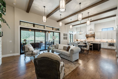 Example of a tuscan open concept family room design in Denver