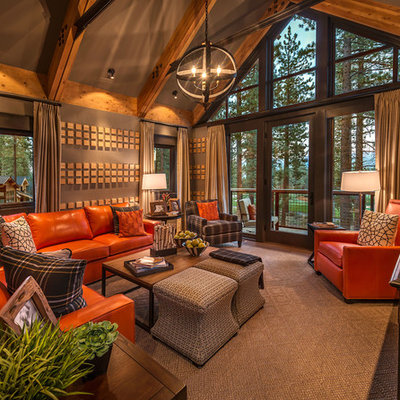 Example of a large mountain style open concept carpeted family room design in Sacramento with brown walls and no fireplace