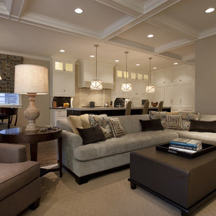 Elegant open concept dark wood floor family room photo in Chicago with beige walls