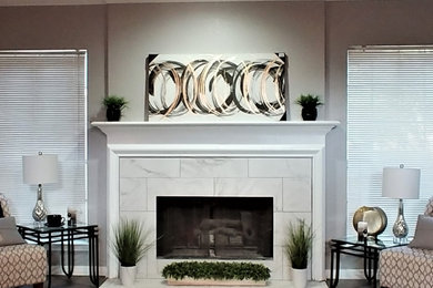 Family room - family room idea in Austin with gray walls and a tile fireplace