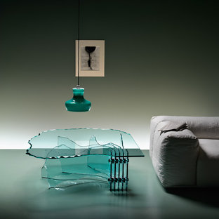 Idee per un grande soggiorno minimalista stile loft con pareti verdi, pavimento in cemento, nessuna TV e pavimento verde