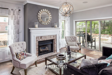 Living room - mid-sized traditional open concept dark wood floor living room idea in Nashville with gray walls, a standard fireplace, a brick fireplace and no tv