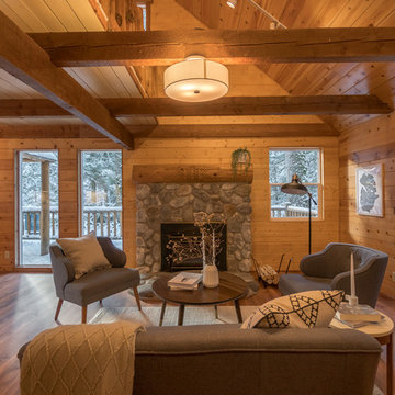 Ski cabin with stone fireplace and open wood beams