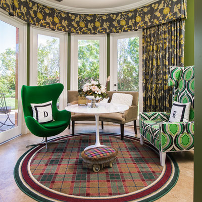 Example of a classic enclosed family room design in Los Angeles with green walls