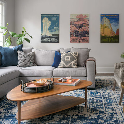 Example of a mid-sized transitional open concept dark wood floor and brown floor family room design in Nashville with gray walls