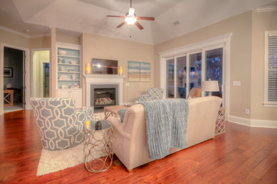 Example of a small beach style open concept family room design in Wilmington with beige walls