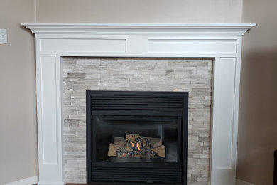 Example of a trendy family room design in Toronto with a standard fireplace