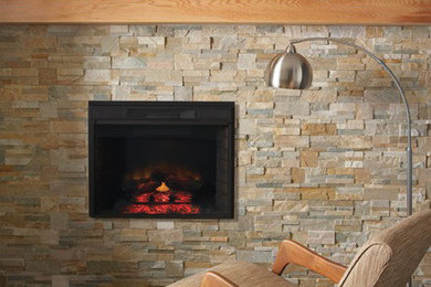 This is an example of a modern games room in Toronto with a standard fireplace and a stone fireplace surround.