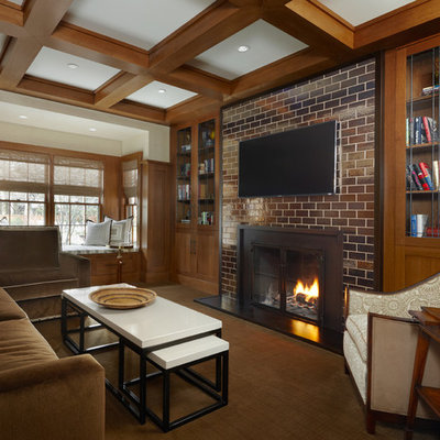 Example of a mid-sized trendy enclosed medium tone wood floor family room library design in Detroit with beige walls, a standard fireplace, a metal fireplace and a wall-mounted tv