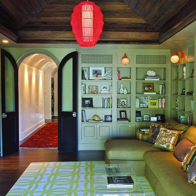 Example of a classic family room design in Charleston with green walls